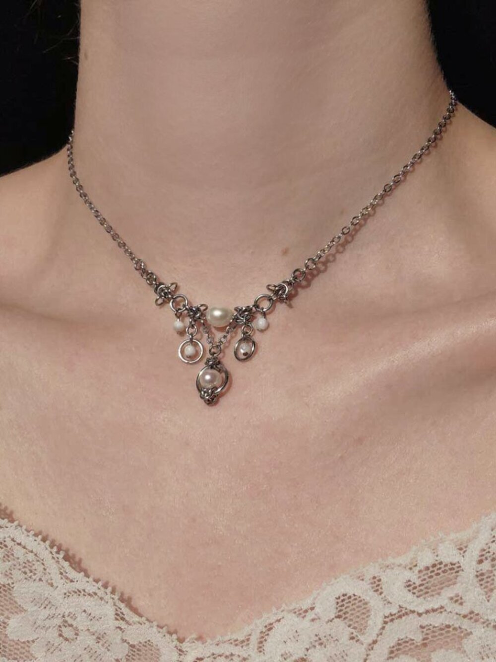 Silver and pearl necklace with a small silver chain